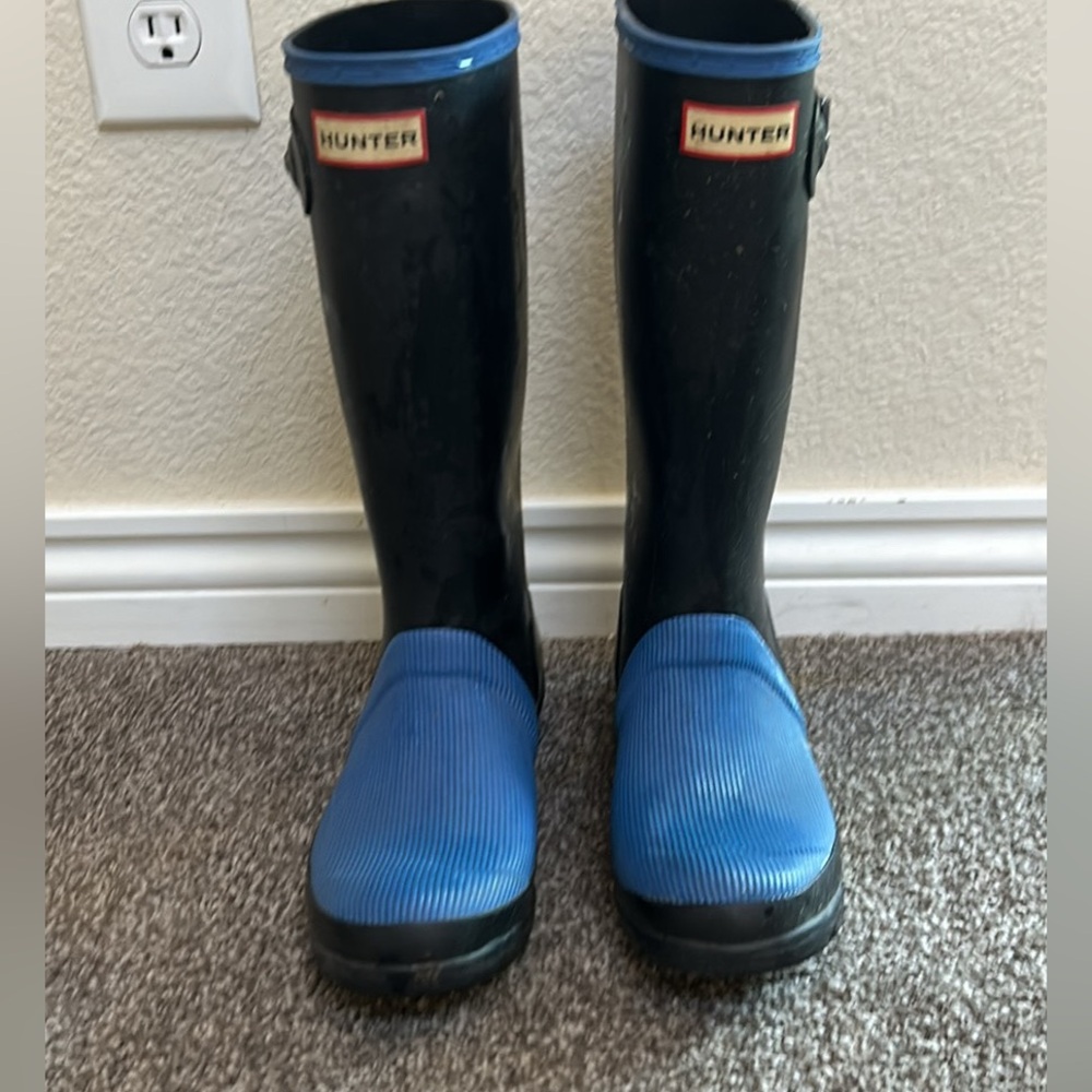 Blue and black Hunter rain boots